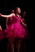 Show Choir - Girl singing in in pink dress.